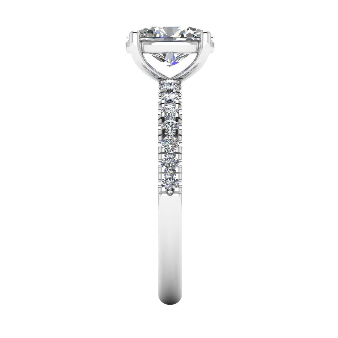 Side view of white gold and platinum engagement ring with oval cut lab grown diamond set on a pave band with side shoulder stones