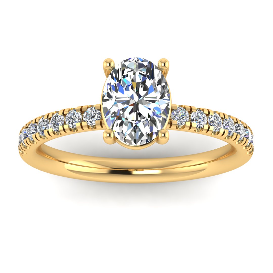Angled view of yellow gold engagement ring with oval cut lab grown diamond set on a pave band with side shoulder stones