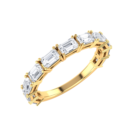 Angled view of a yellow gold half set eternity ring with emerald cut lab grown diamonds set horizontally