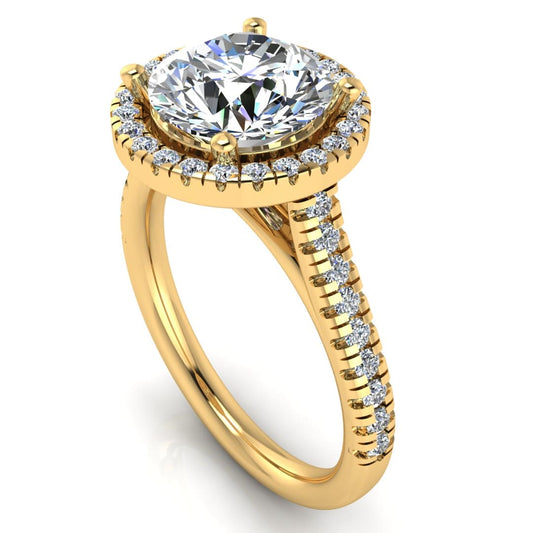 Angled view of Holly yellow gold lab grown diamond engagement ring with halo and side shoulder diamonds