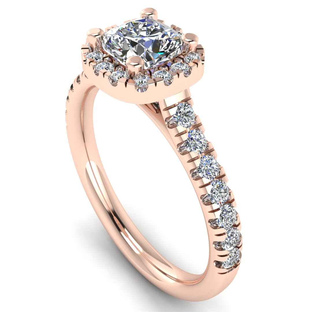 angled view of a rose gold engagement ring which features a cushion cut lab-grown diamond with a halo and pavé-set shoulders