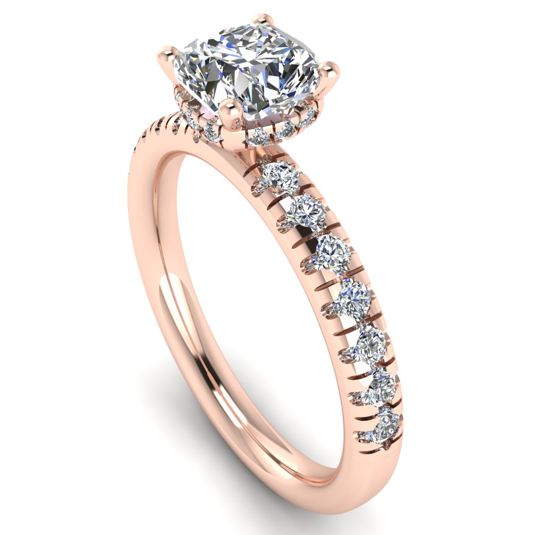 angled view of a rose gold cushion cut lab grown diamond engagement ring with pavé shoulders and a hidden halo