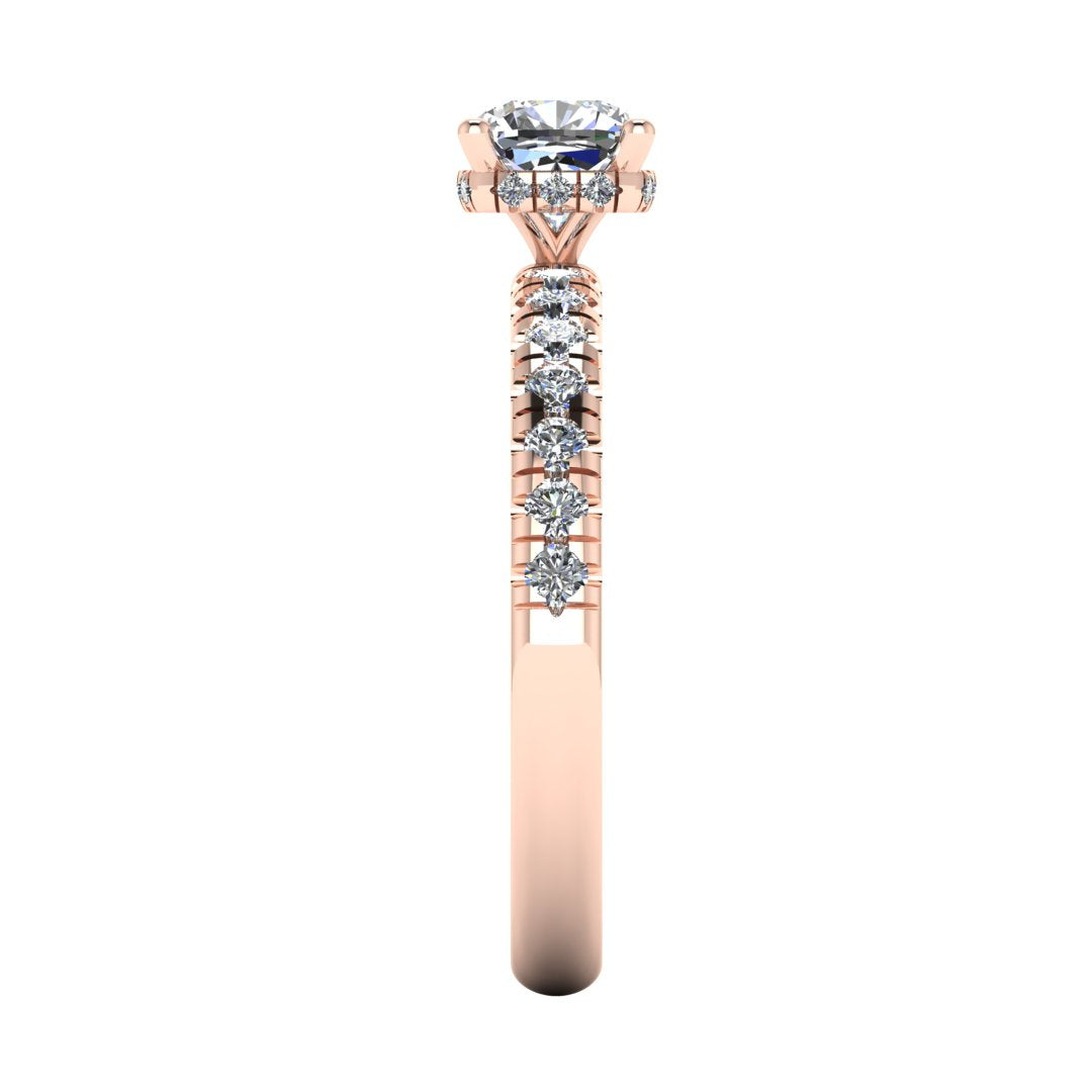 side view of a rose gold cushion cut lab grown diamond engagement ring with pavé shoulders and a hidden halo