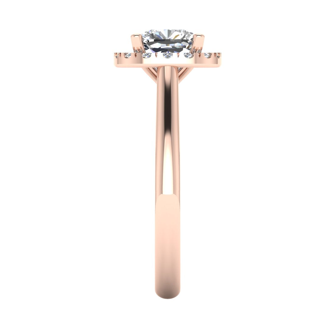 side view of a rose gold cushion cut lab grown diamond engagement ring framed by a sparkling halo