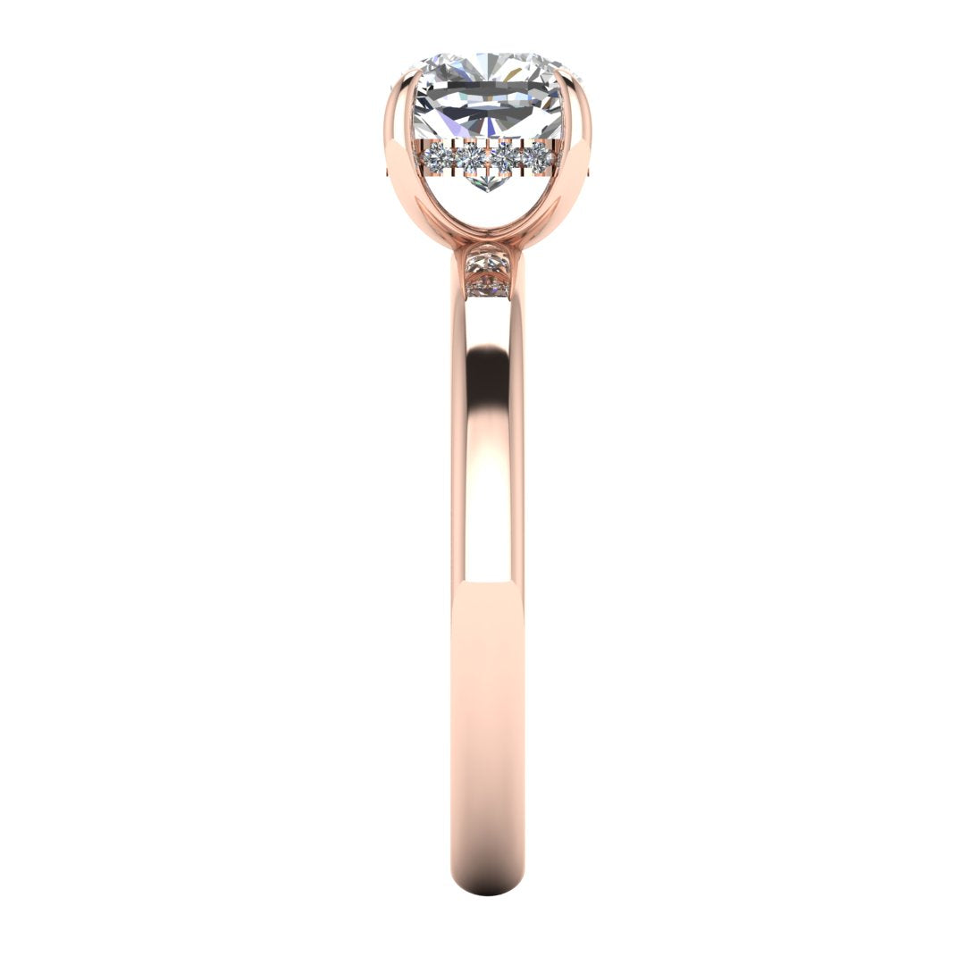 side view of a rose gold engagement ring featuring a cushion cut lab grown diamond with a hidden halo in a solitaire design