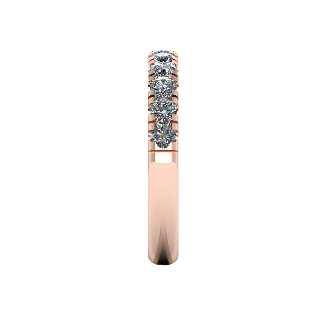side view of a rose gold wedding band eternity ring with half micro-set round lab grown diamonds which fit most engagement rings