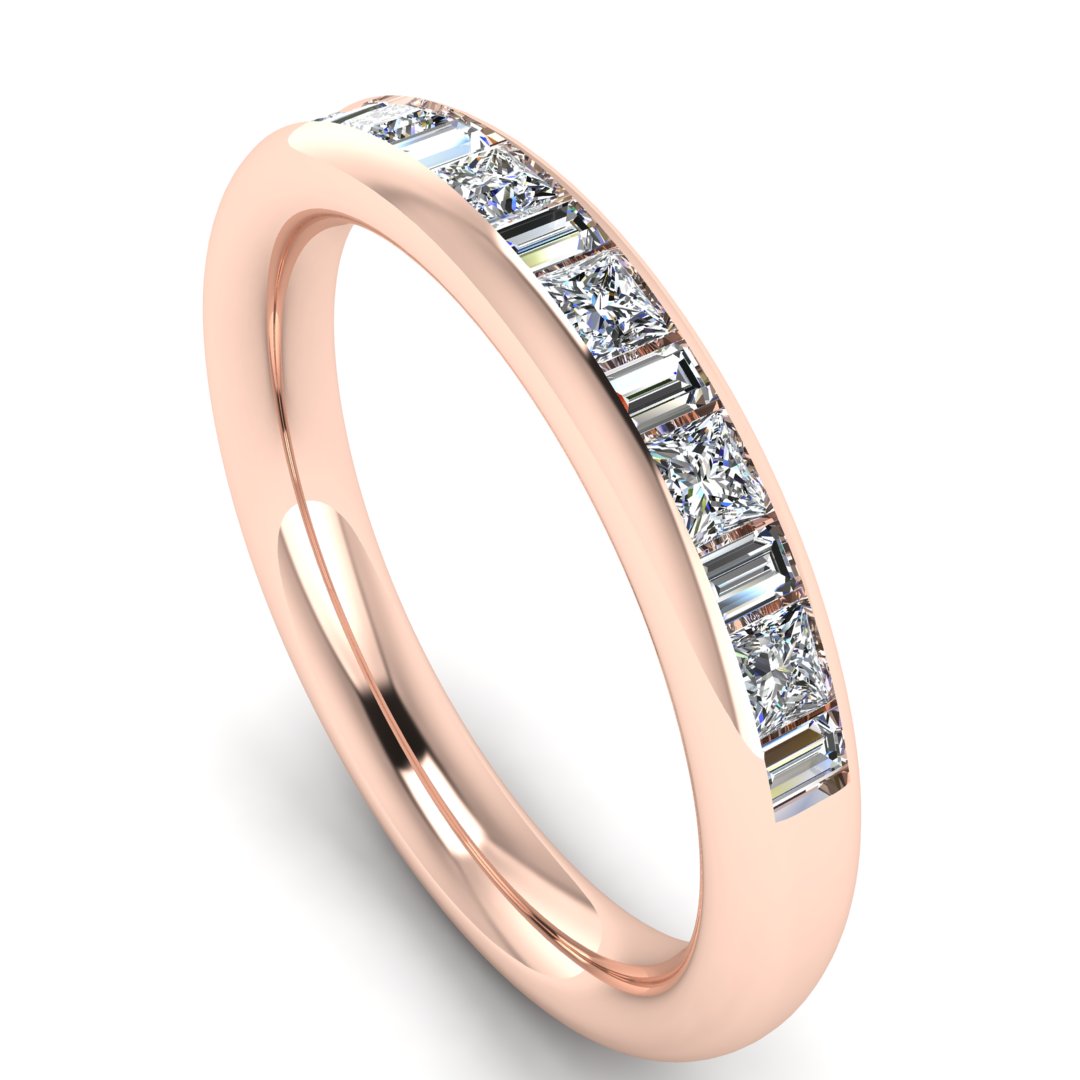 angled view of a rose gold wedding band with princess and baguette lab-grown diamond in a channel set design