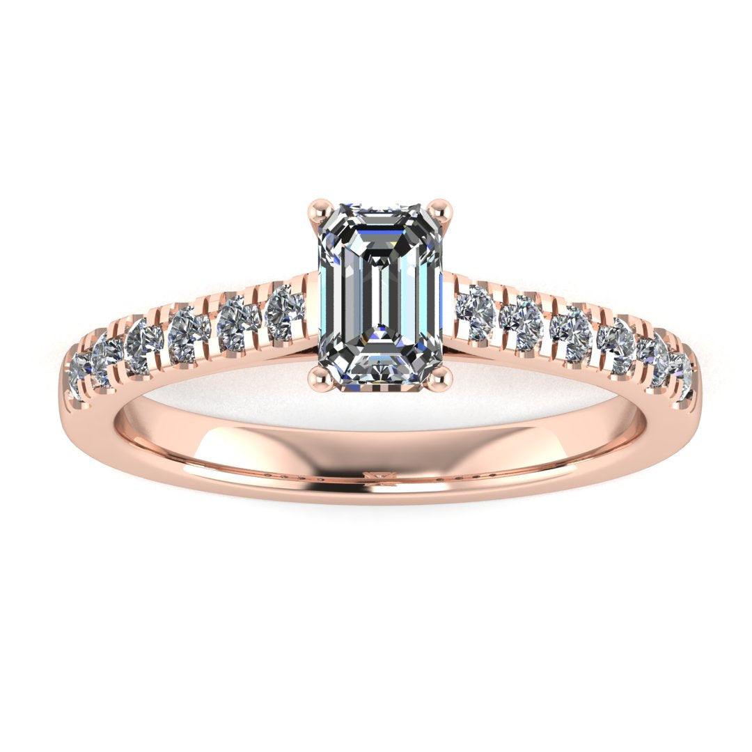 front view of a rose gold engagement ring with an emerald cut lab-grown diamond as the centre stone with pavé-set diamond shoulders
