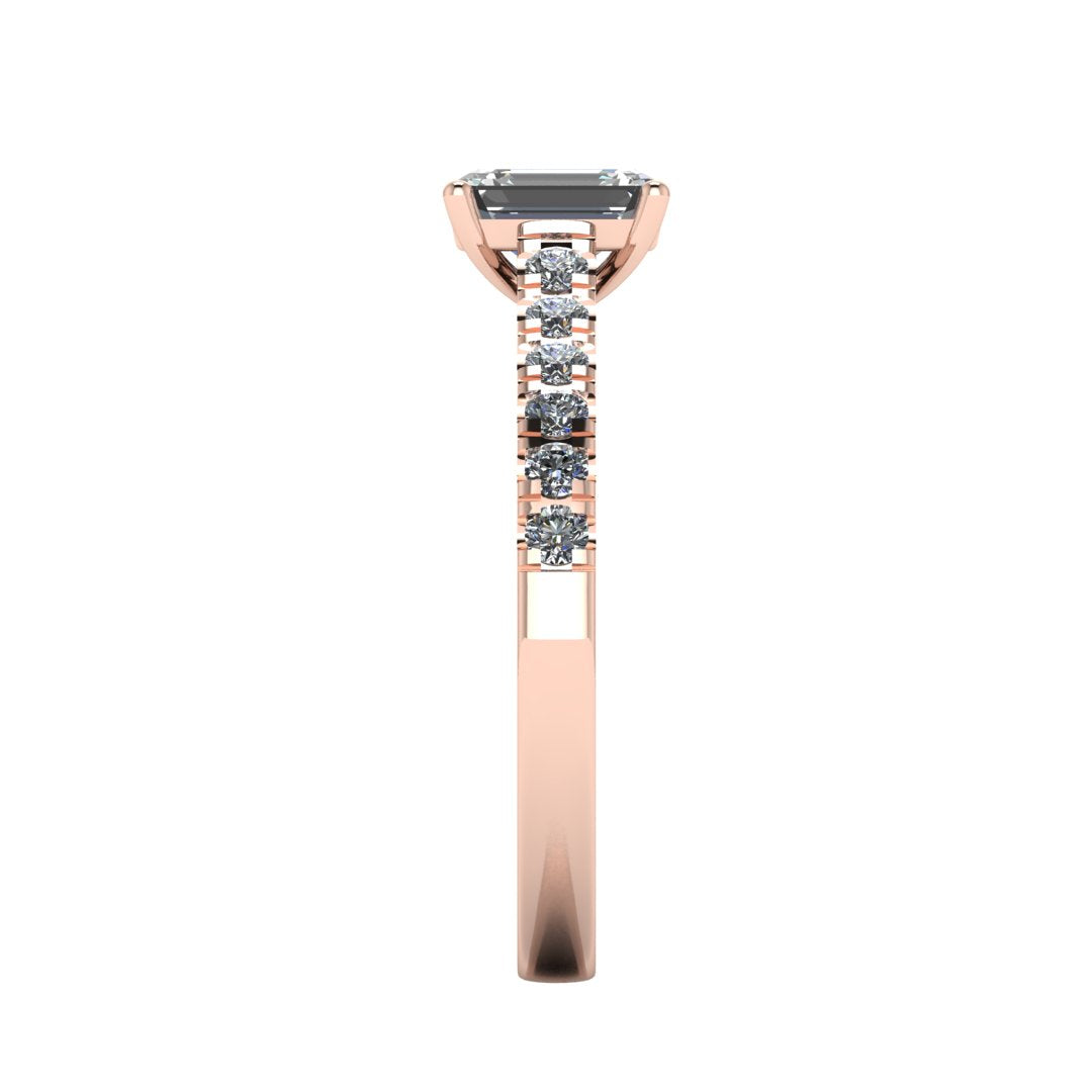side view of a rose gold engagement ring with an emerald cut lab-grown diamond as the centre stone with pavé-set diamond shoulders