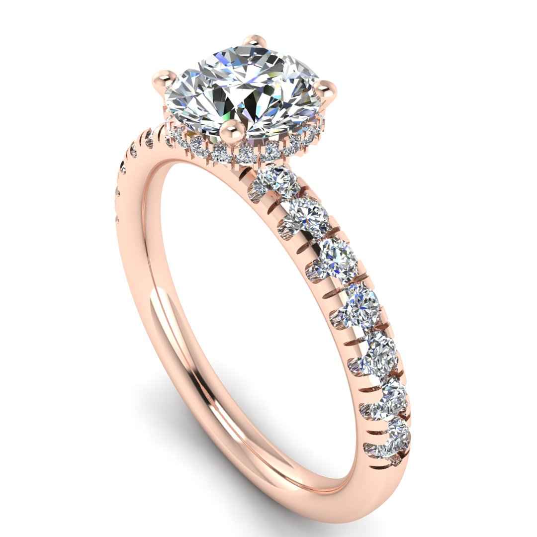 Angled view in rose gold of Emma lab grown engagement ring with round brilliant, side shoulders and under halo