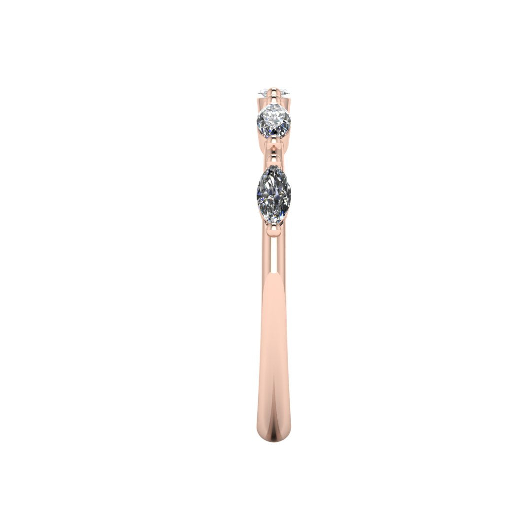 side view of a rose gold station set wedding band with marquise lab grown diamonds