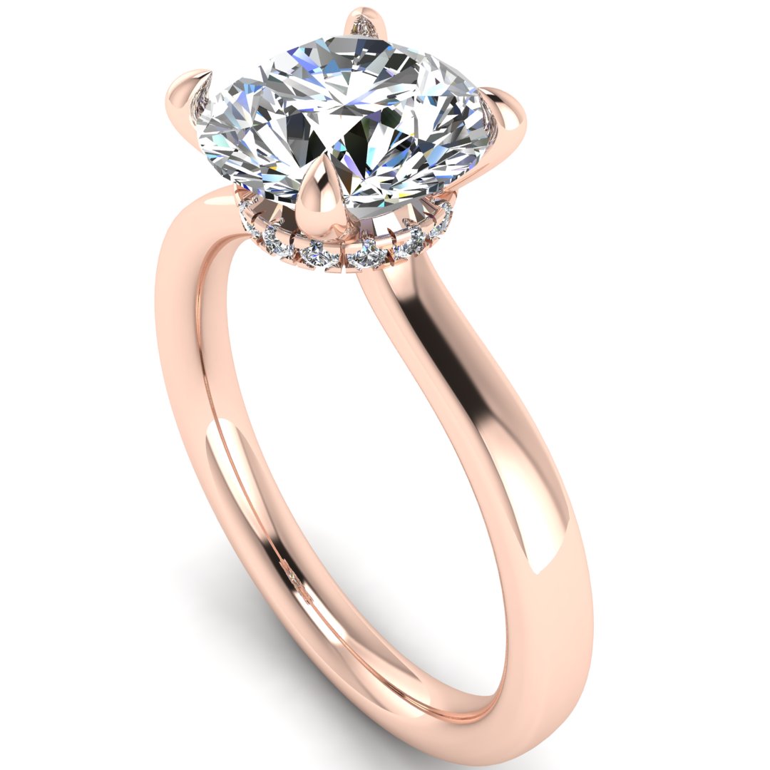 Angled view of Helan round brilliant engagement ring with a secret hidden halo in rose gold
