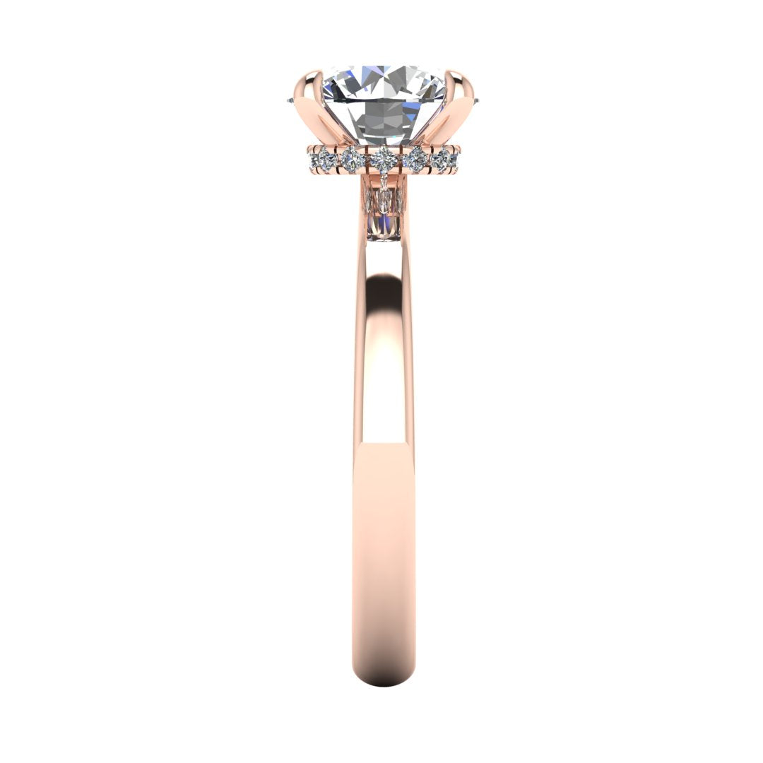 Side view of Helan round brilliant engagement ring with a secret hidden halo in rose gold