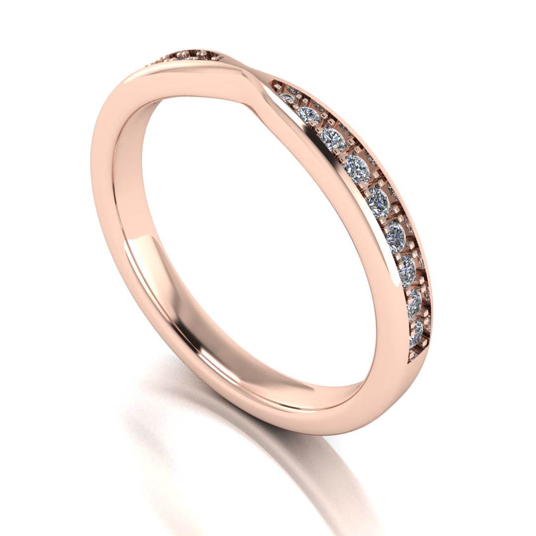 angled view of rose gold tapered wedding band. Round lab-grown diamonds appear in a graduated setting starting from the middle and gradually increasing in size towards the edges