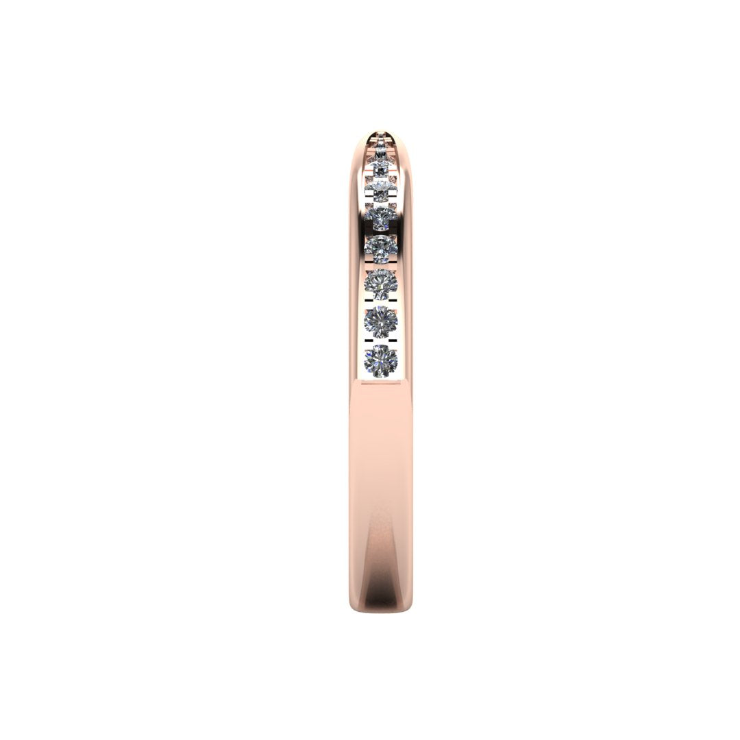 side view of rose gold tapered wedding band. Round lab-grown diamonds appear in a graduated setting starting from the middle and gradually increasing in size towards the edges