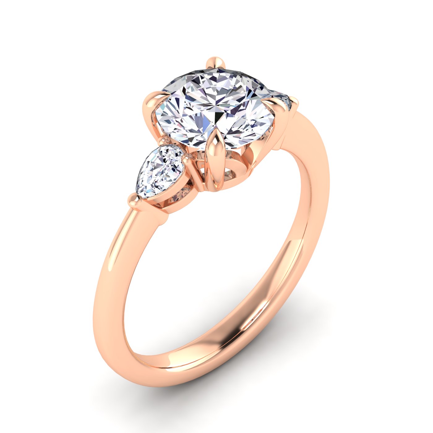 Angled view of a rose gold trilogy engagement ring using round and pear shaped lab grown diamonds