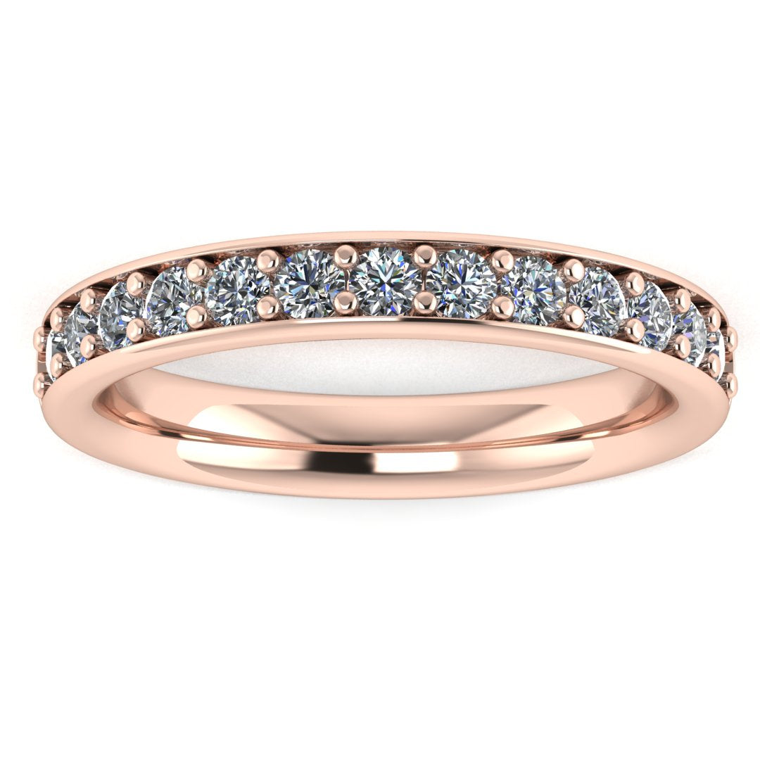 front view of a rose gold eternity ring or wedding band with round brilliant lab-grown diamonds set in a fine grain setting