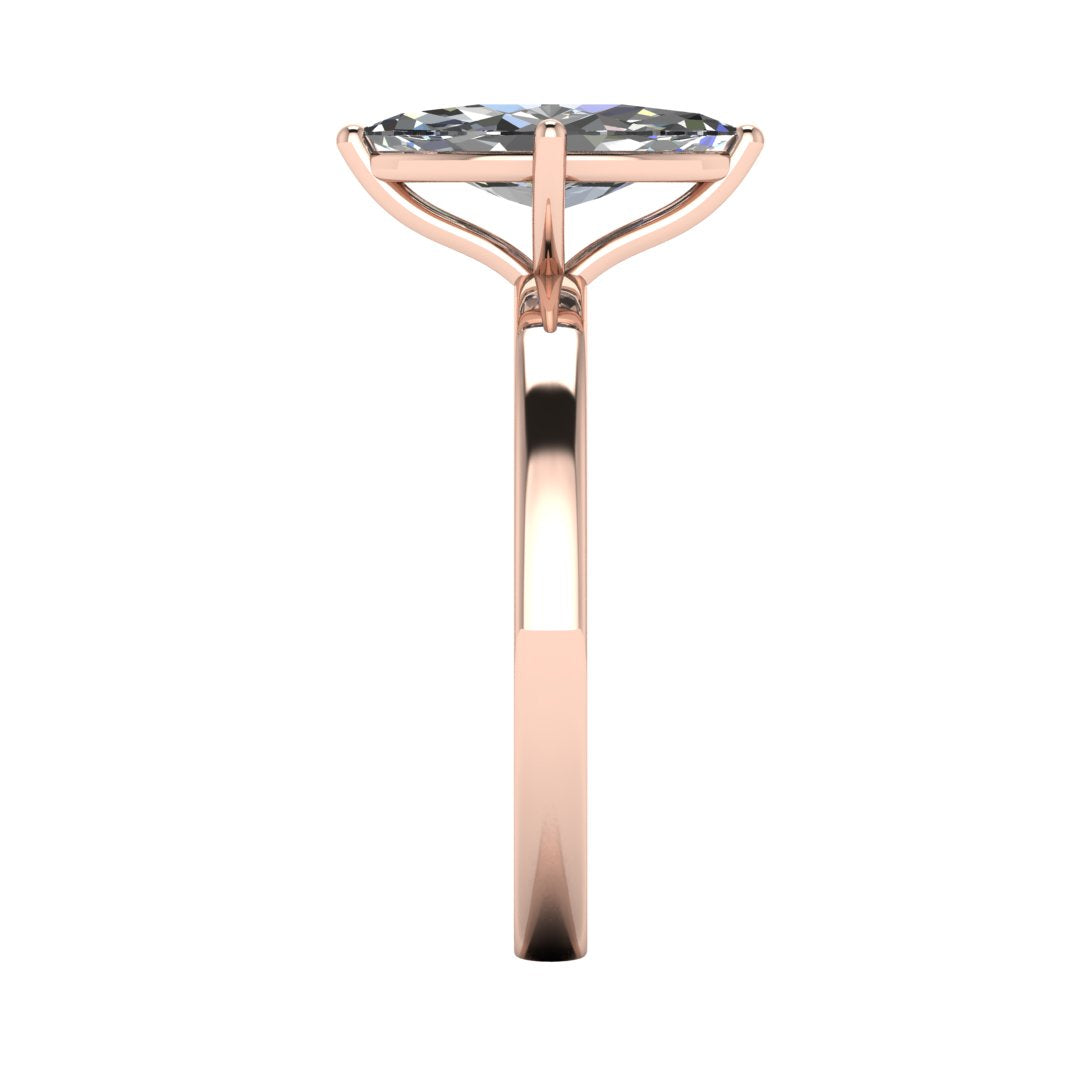 side view of a rose gold lab grown marquise diamond engagement ring. It is a single solitaire ring with a floating setting