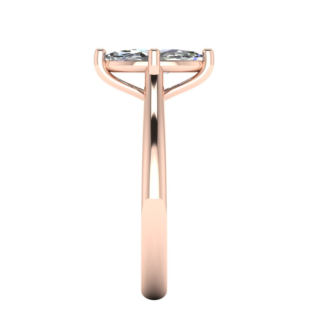 side view of rose gold single solitaire engagement ring with a marquise cut lab grown ethical and sustainable diamond in a cathedral setting