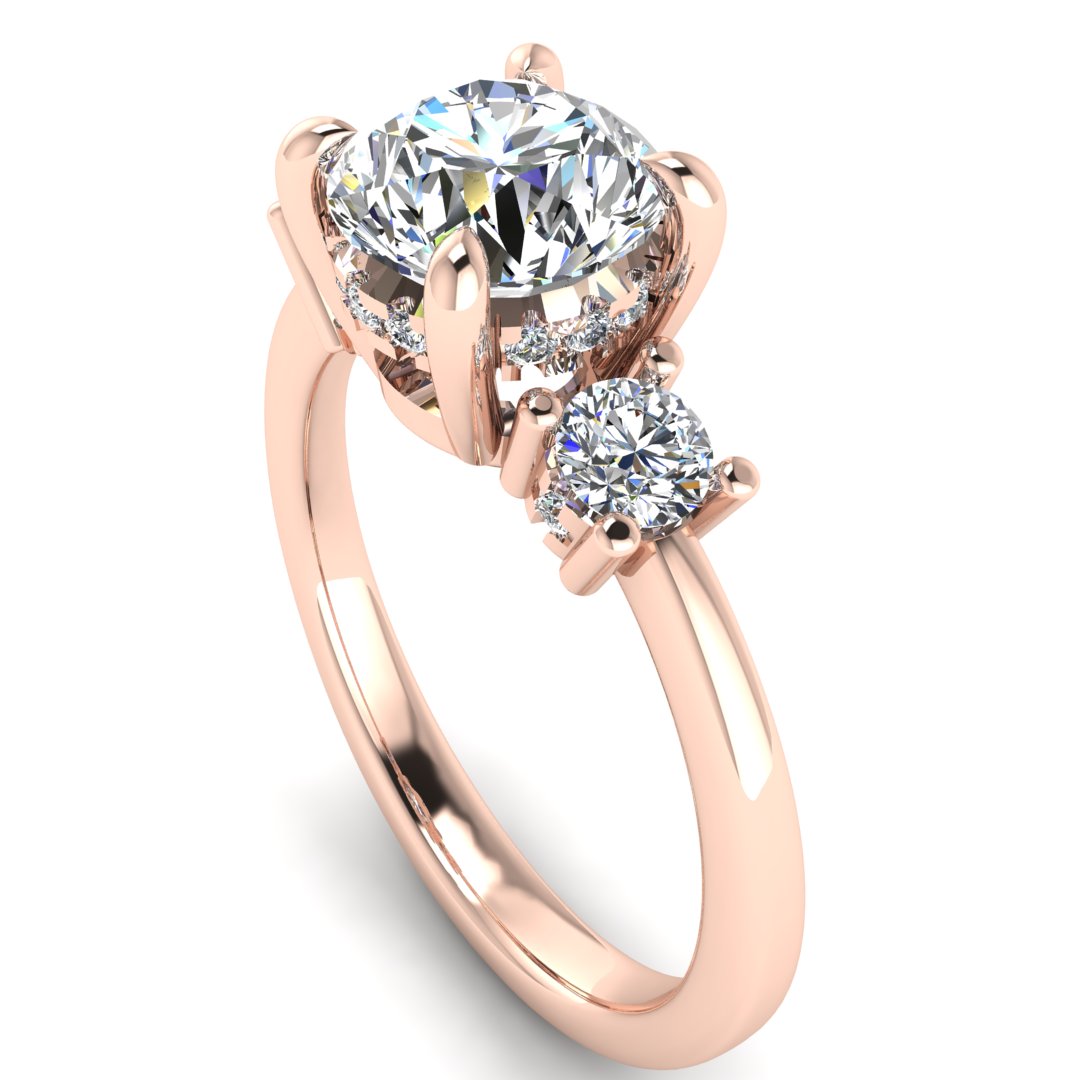 Angled view of rose gold trilogy engagement ring with three round brilliant lab grown diamond