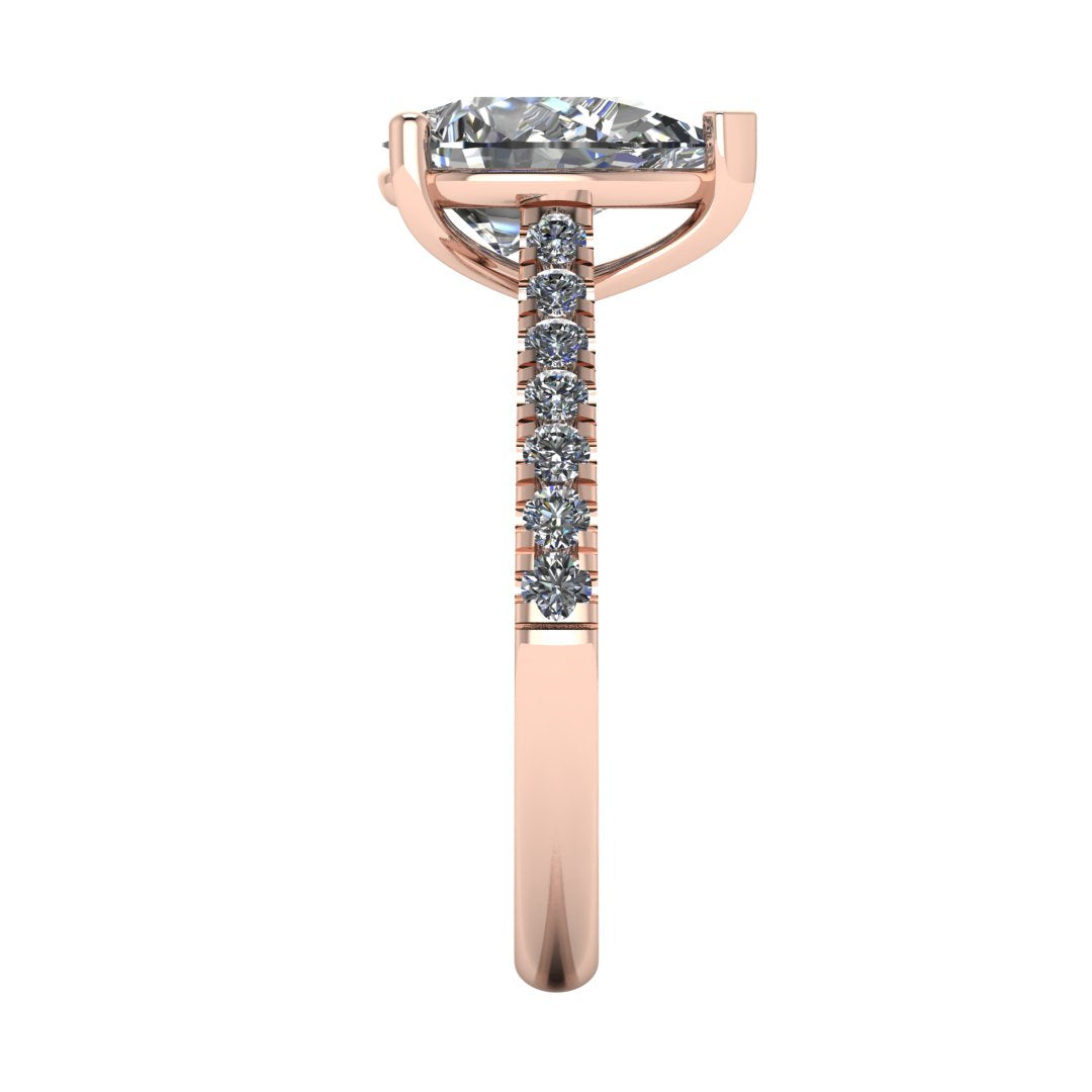 side view of rose gold pavé engagement ring with a pear shaped centre lab grown diamond and microset diamond shoulder