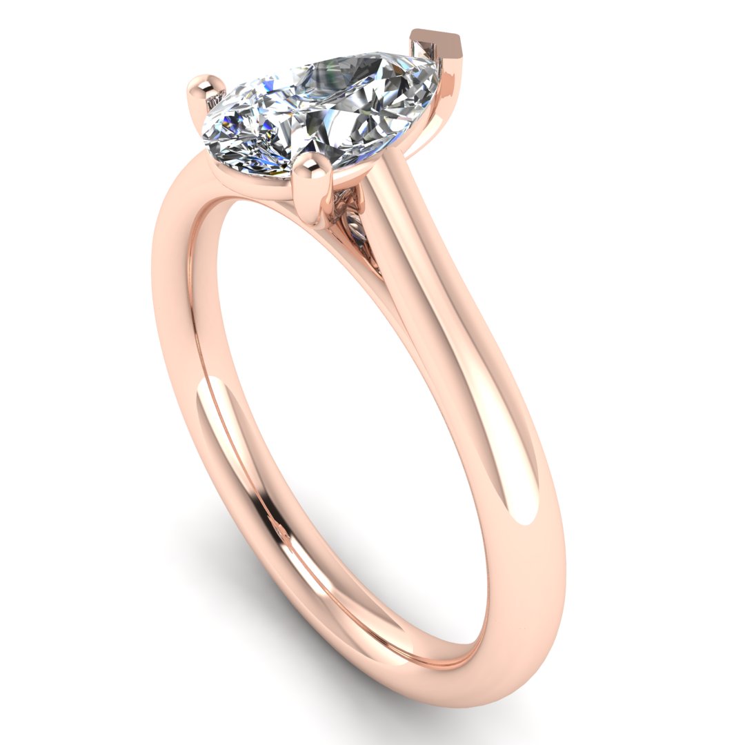 angled view of rose gold engagement ring with a pear cut lab grown diamond which is ethical and sustainable
