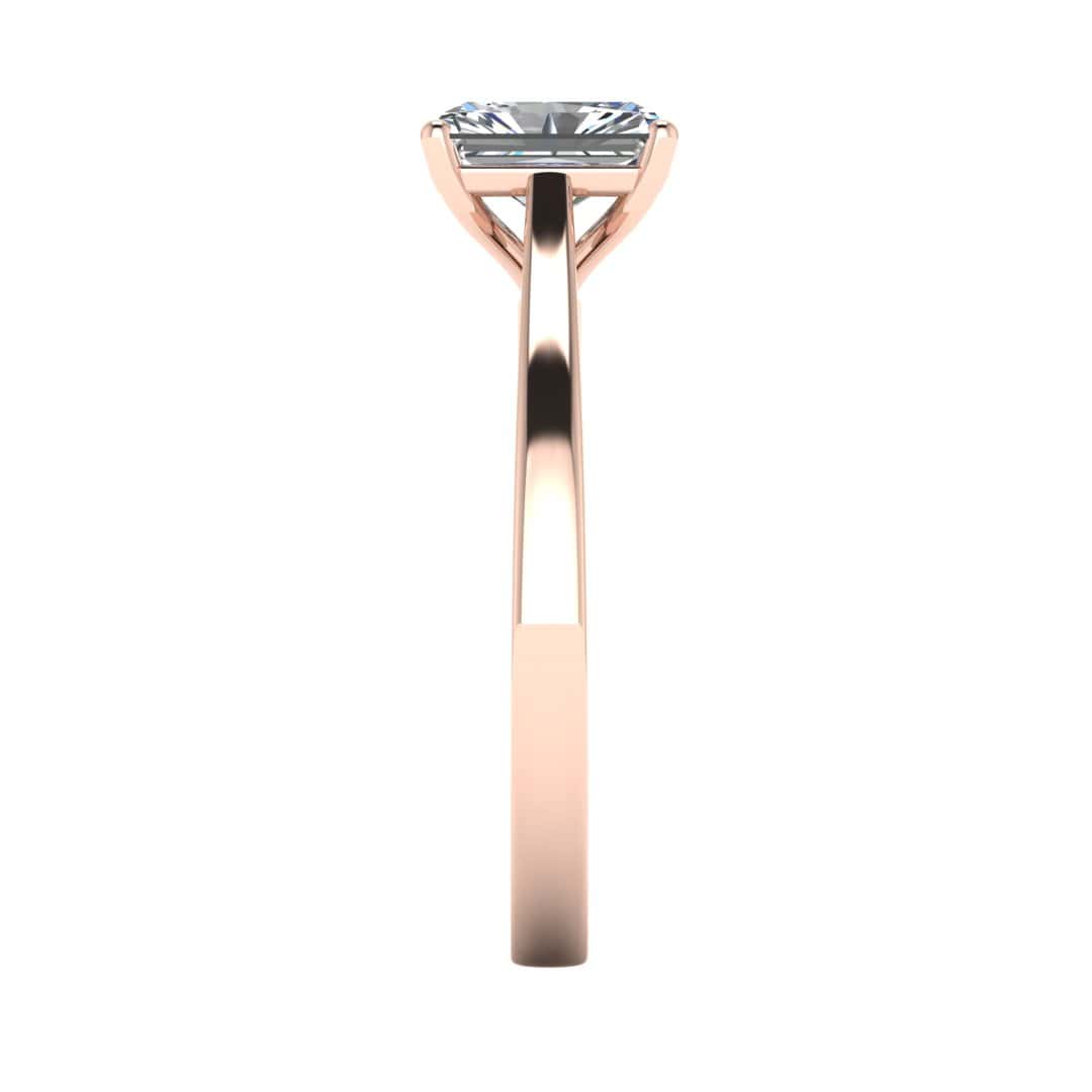 side view of a rose gold engagement ring set with a radiant cut lab grown diamond with 4 claws
