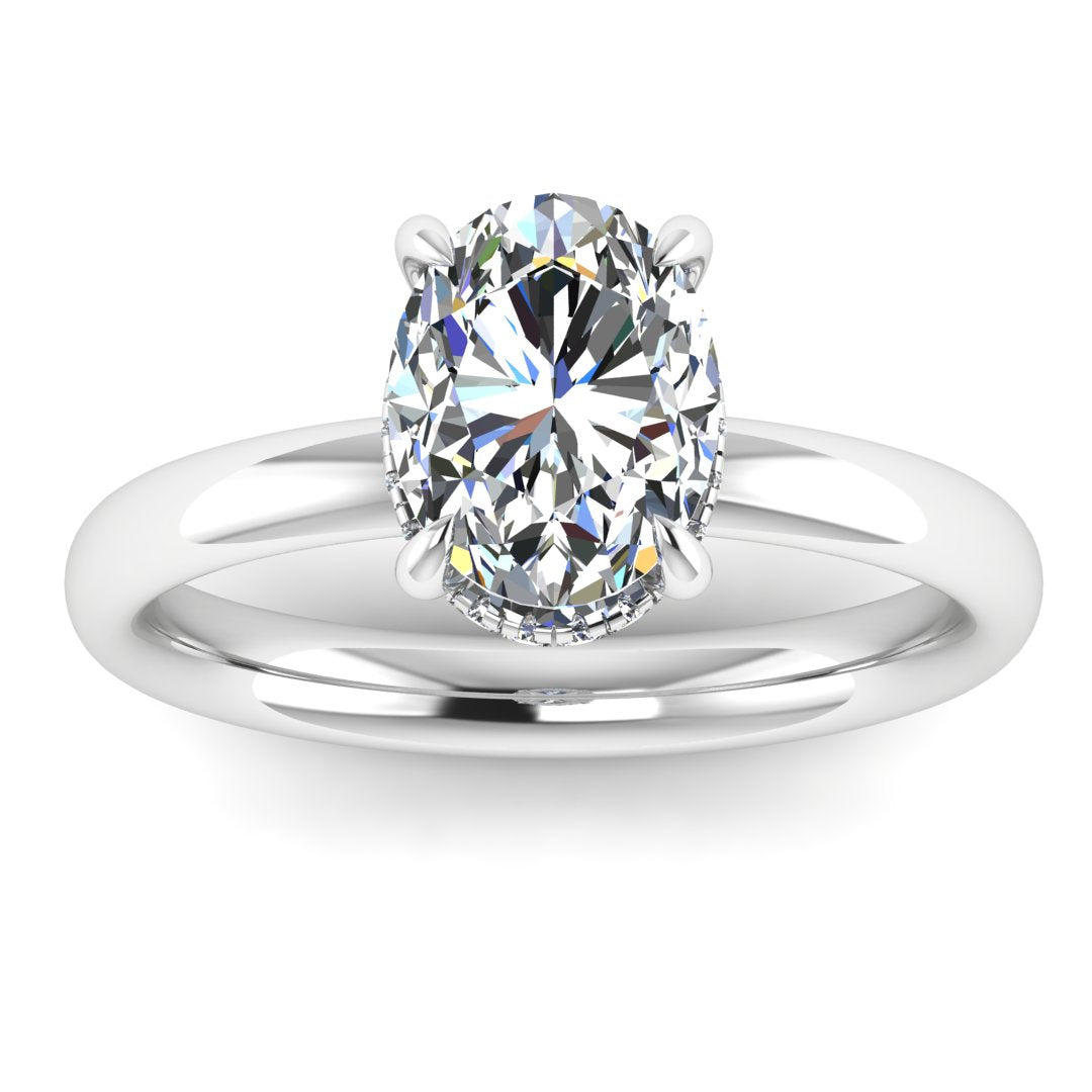 Front profile of a white gold and platinum engagement ring with a oval cut lab grown diamond with a secret hidden halo