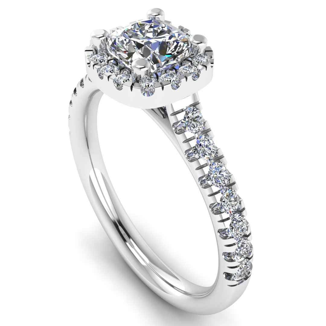 angled view of a platinum or white gold engagement ring which features a cushion cut lab-grown diamond with a halo and pavé-set shoulders