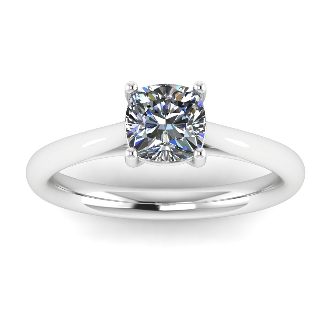 front view of a platinum or white gold single solitaire engagement ring featuring a cushion cut lab grown diamond in a cathedral setting with 4 claws