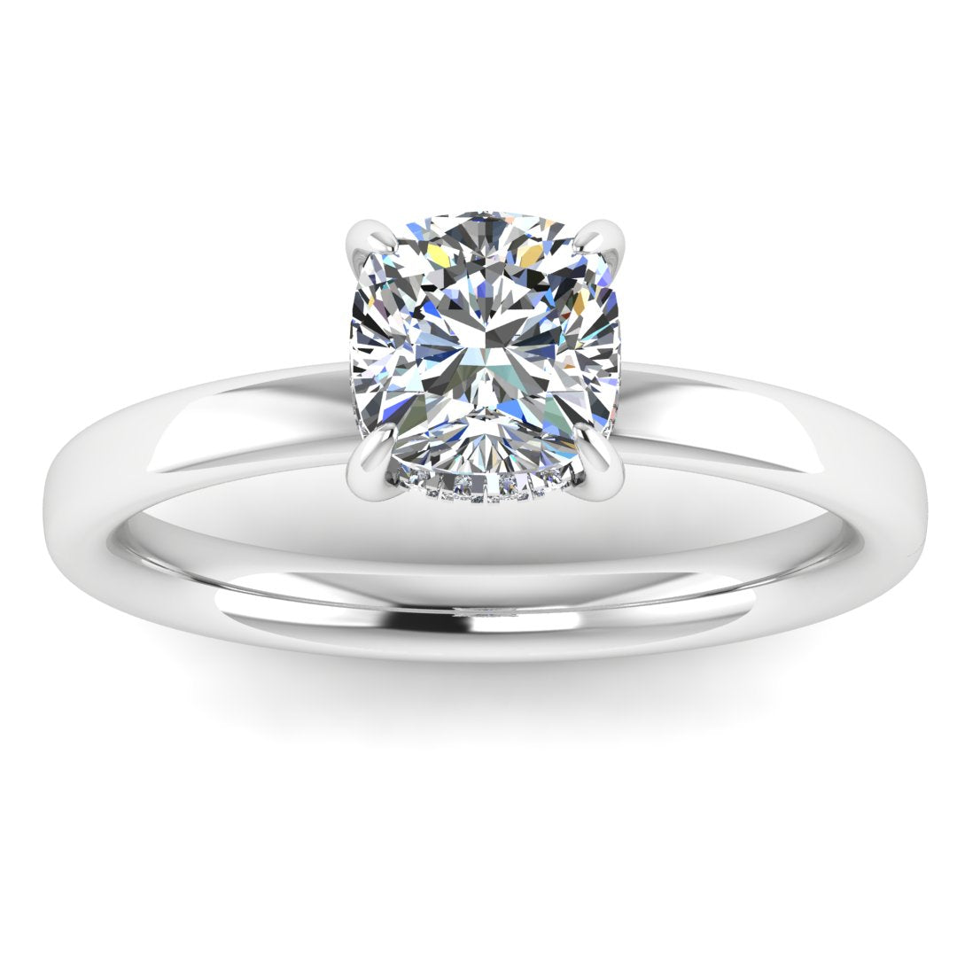 front view of a platinum or white gold engagement ring featuring a cushion cut lab grown diamond with a hidden halo in a solitaire design