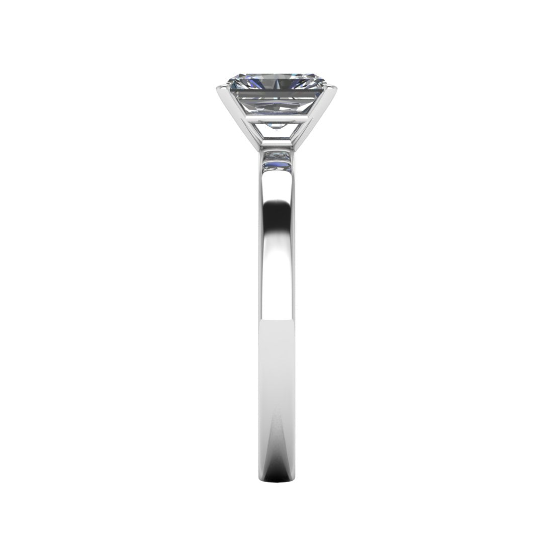side view of platinum or white gold engagement ring with an emerald cut lab grown diamond as the centre stone in a floating setting