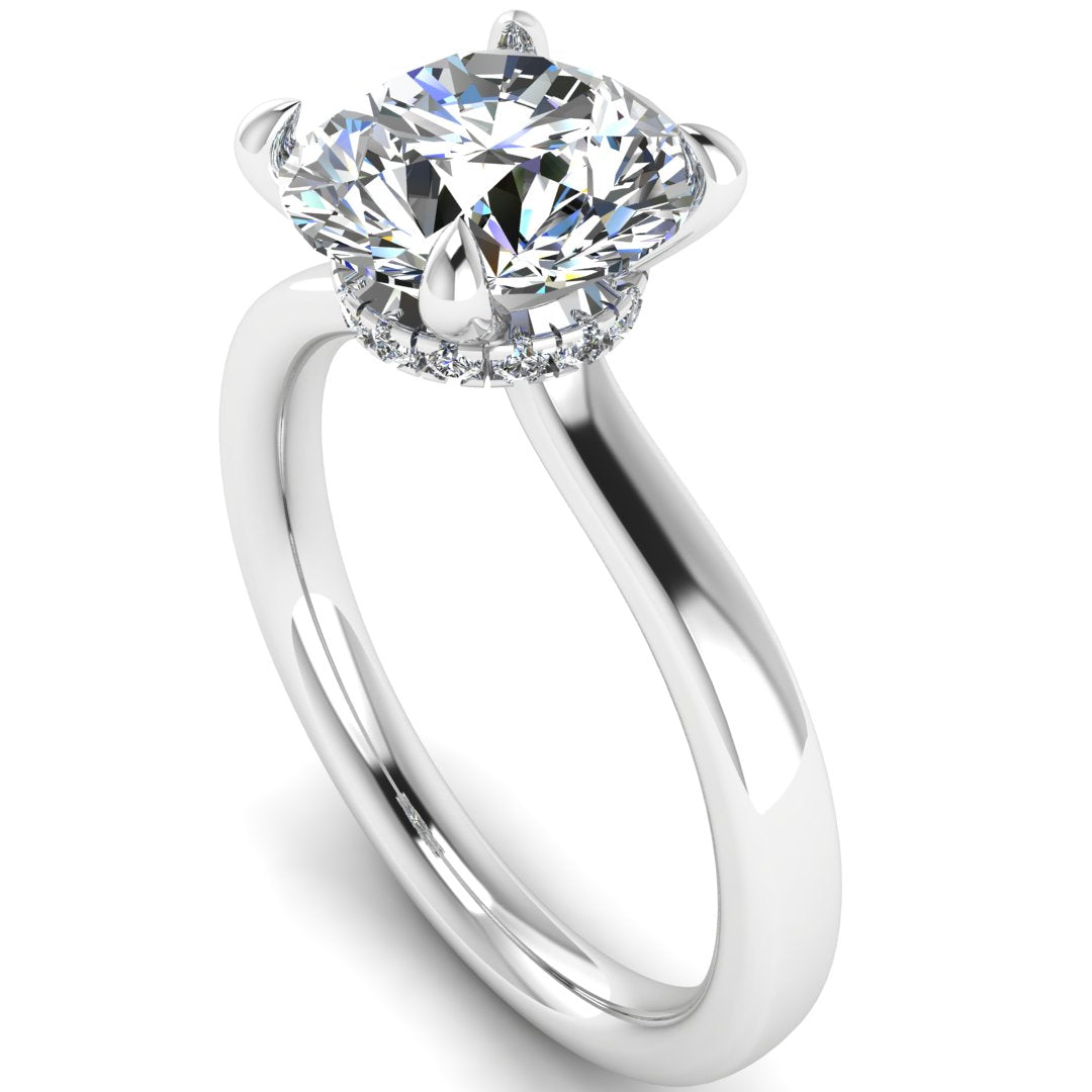 Angled view of Helan round brilliant engagement ring with a secret hidden halo in white gold and platinum
