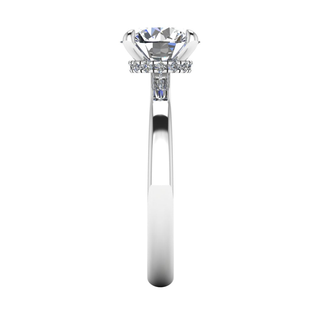 Side view of Helan round brilliant engagement ring with a secret hidden halo in white gold and platinum