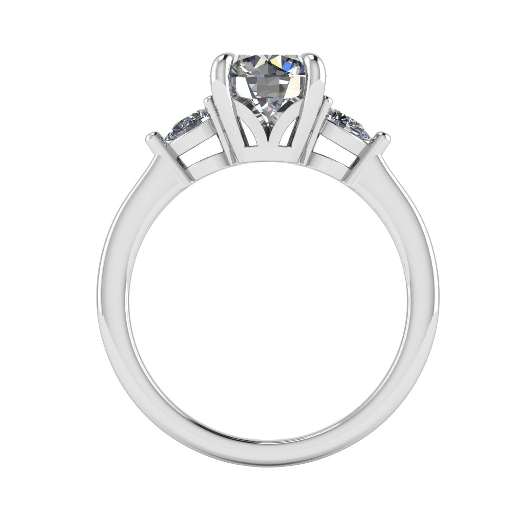 Flat view of a white gold and platinum trilogy engagement ring using round and pear shaped lab grown diamonds