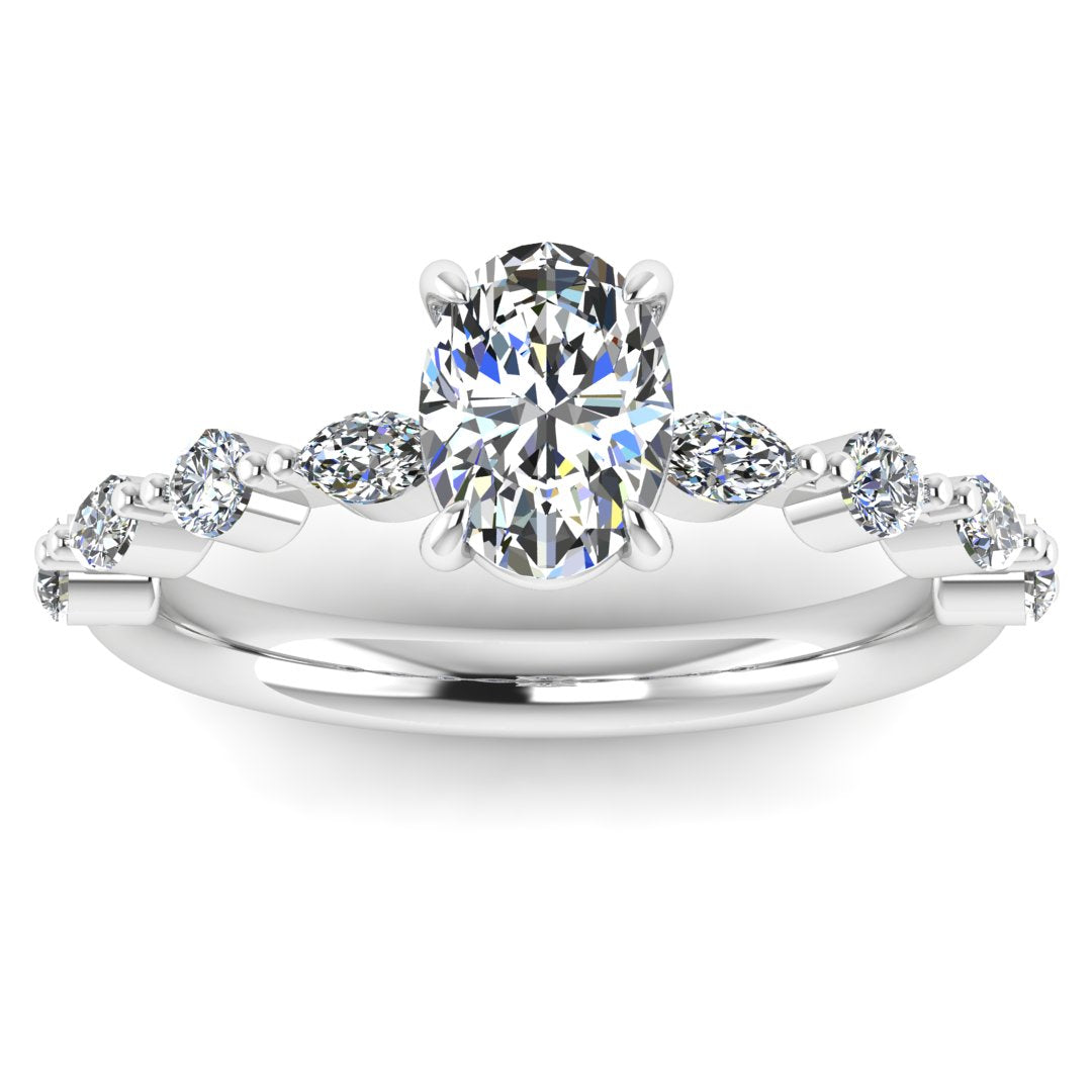 Front view of platinum or white gold of Lily engagement ring with an oval cut centre stone surrounded by alternating smaller round and marquise stones on the shoulder