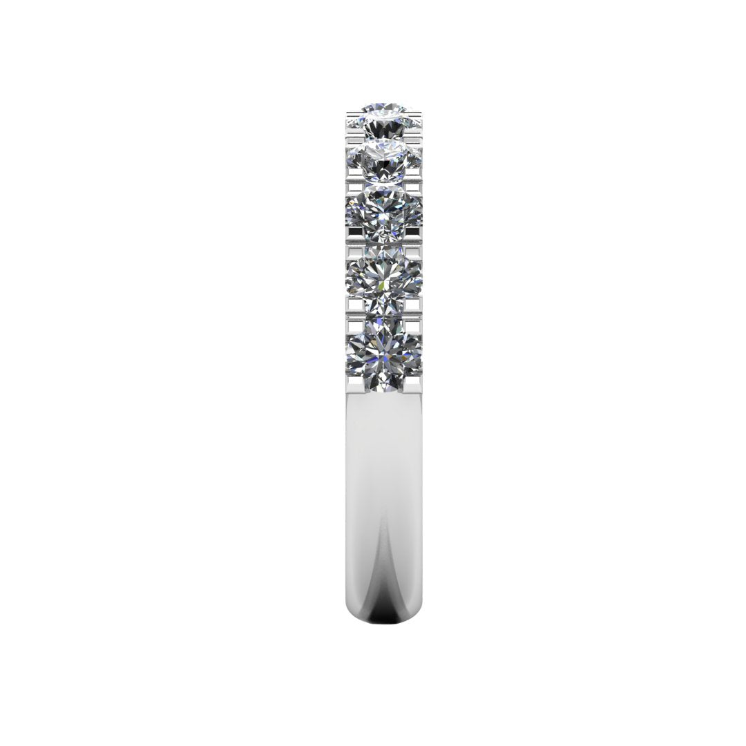 side view of a platinum or white gold wedding band or half eternity ring which is scallop set with round brilliant lab-grown diamond