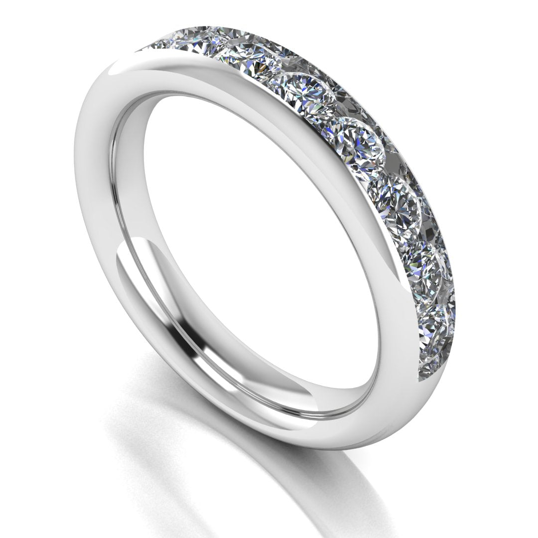 angled view of a platinum or white gold eternity ring or wedding band with round brilliant lab grown diamonds in a channel setting