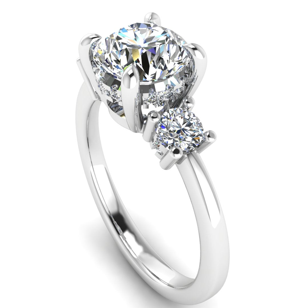 Angled view of white gold and platinum trilogy engagement ring with three round brilliant lab grown diamond