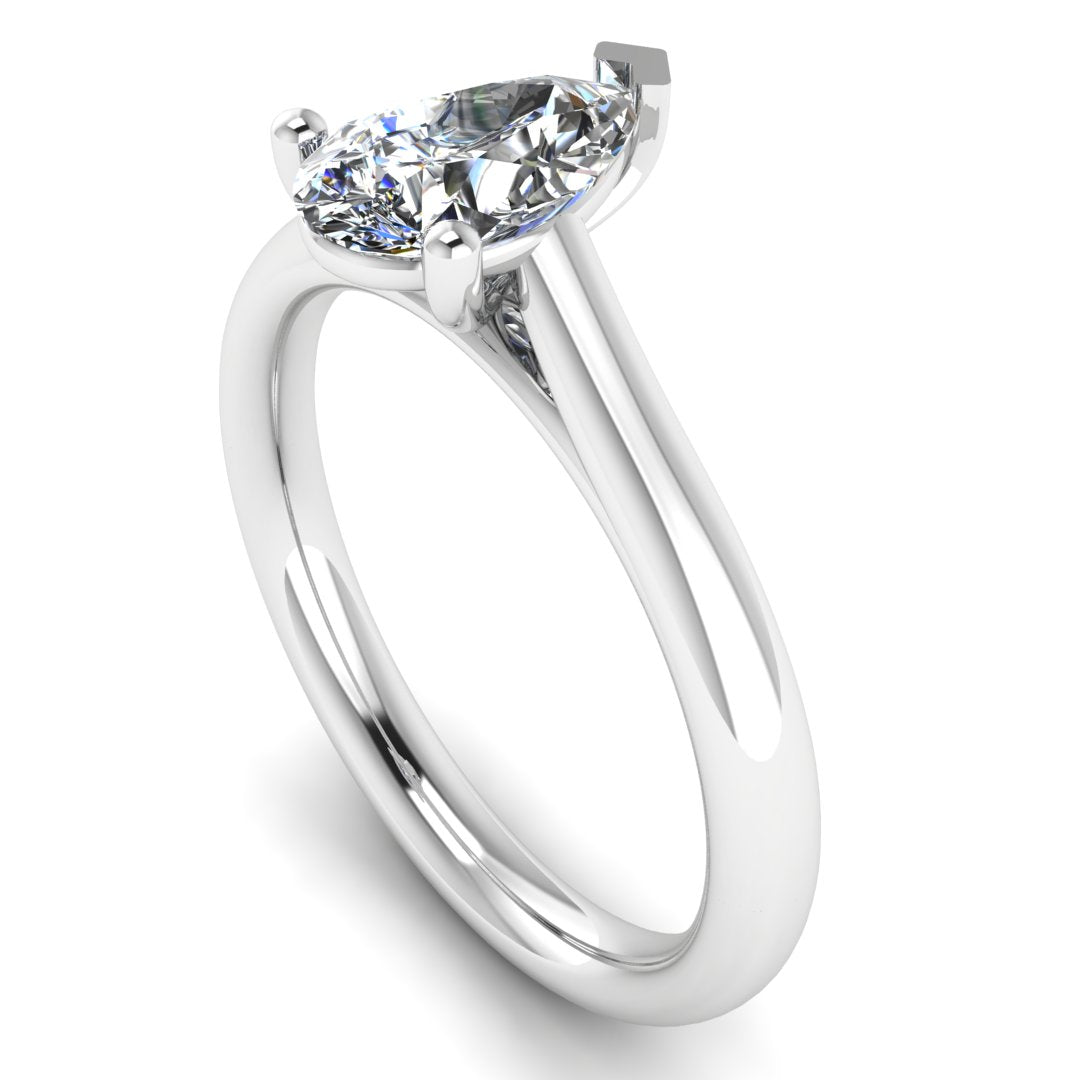 angled view of platinum or white gold engagement ring with a pear cut lab grown diamond which is ethical and sustainable