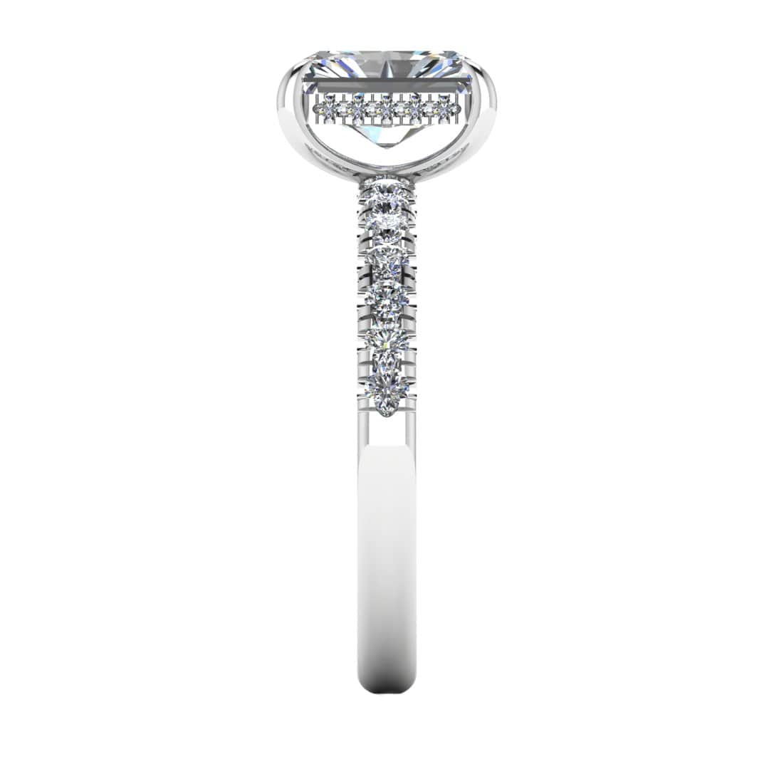 side view of platinum or white gold engagement ring featuring a radiant cut lab-grown diamond with pavé-set shoulders and a hidden halo