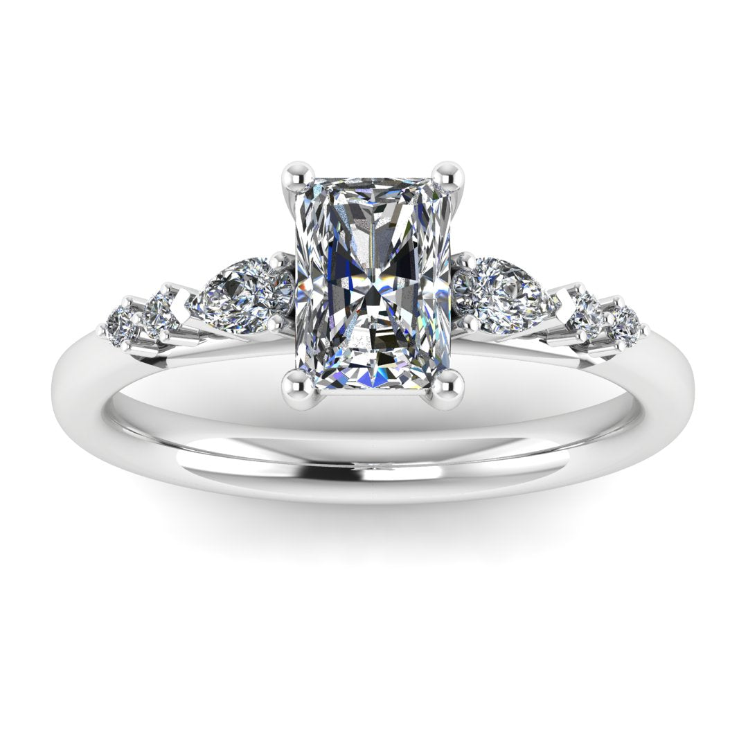 front view of a platinum or white gold multi-stone lab grown diamond engagement ring. It features a radiant cut lab-grown diamond with one pear and two round side diamonds on either side