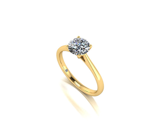 Angled view of the Arya Engagement ring in yellow gold. A traditional single solitaire round brilliant lab grown diamond in a cathedral setting