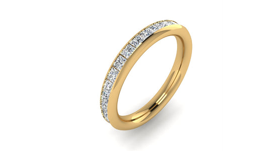 angled view of a yellow gold lab grown diamond channel set wedding band with princess cut lab grown diamonds