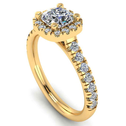angled view of a yellow gold engagement ring which features a cushion cut lab-grown diamond with a halo and pavé-set shoulders