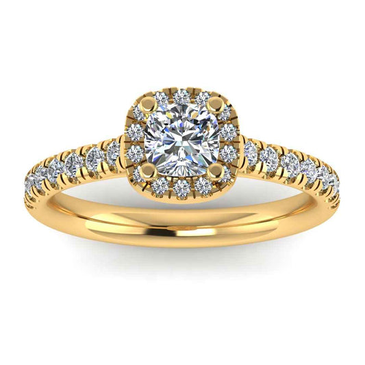 front view of a yellow gold engagement ring which features a cushion cut lab-grown diamond with a halo and pavé-set shoulders