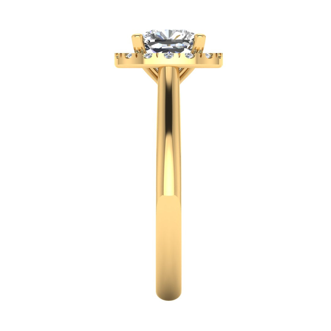 side view of a yellow gold cushion cut lab grown diamond engagement ring framed by a sparkling halo