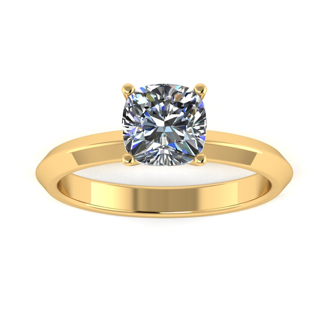 front view of yellow gold engagement ring featuring a cushion cut lab grown diamond in a floating setting with 4 claws