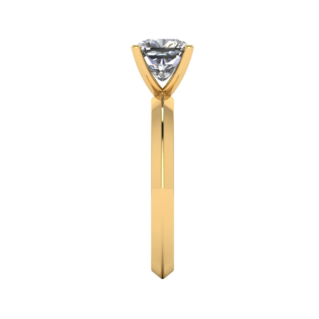 side view of yellow gold engagement ring featuring a cushion cut lab grown diamond in a floating setting with 4 claws