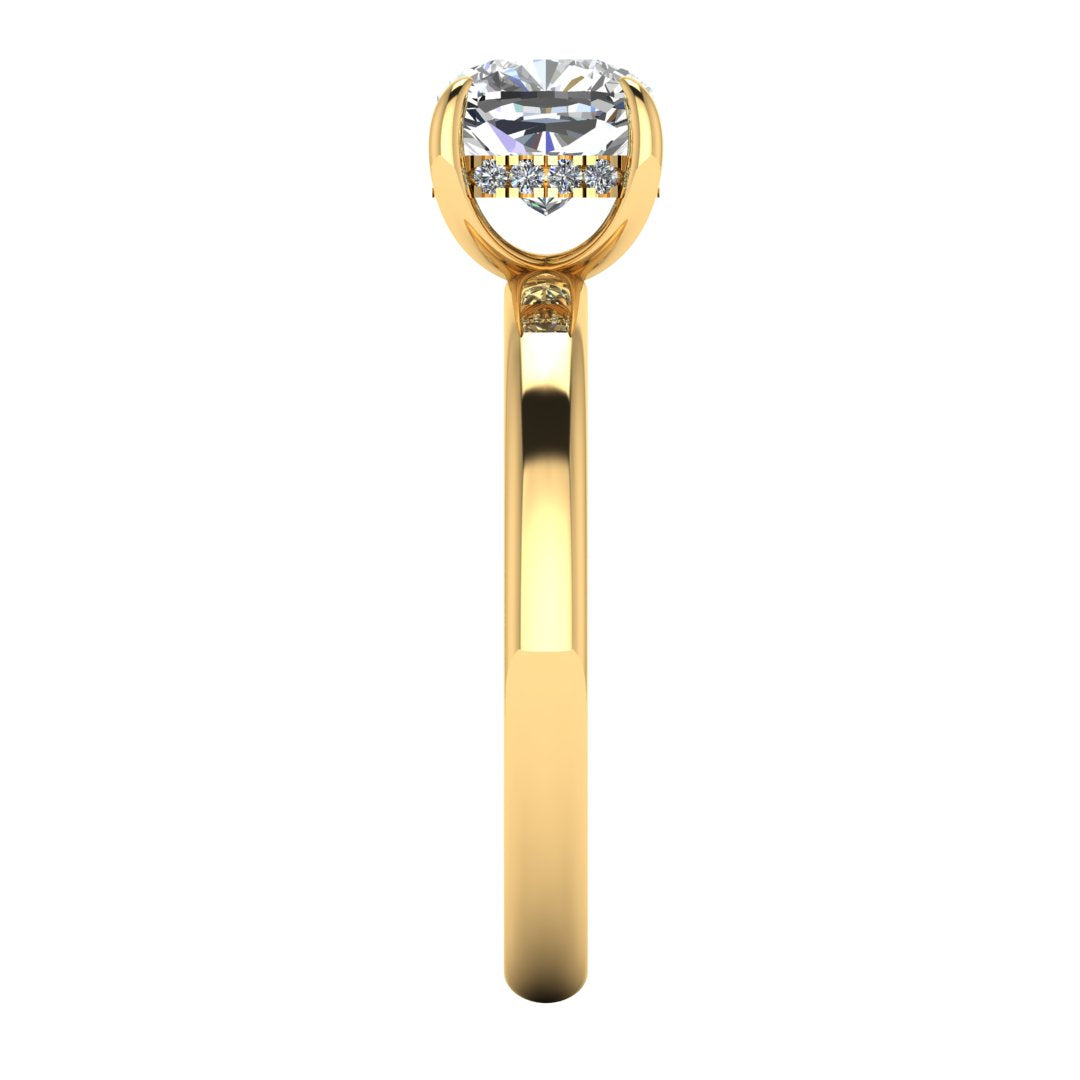 side view of a yellow gold engagement ring featuring a cushion cut lab grown diamond with a hidden halo in a solitaire design